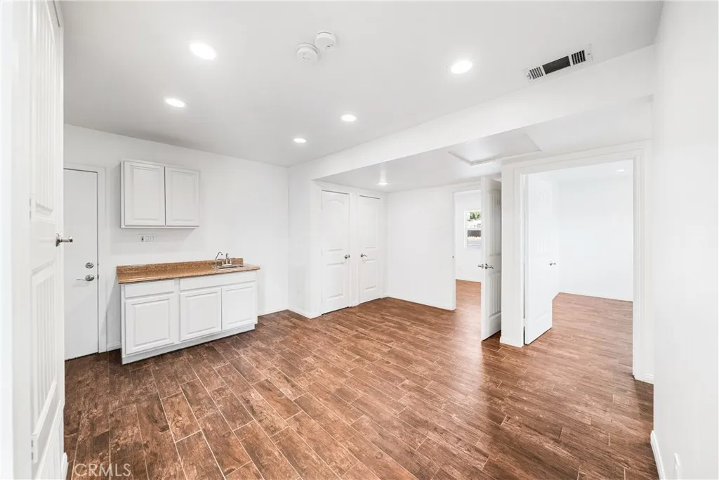 open kitchenet with 2 closet storage area opening to 2 office spaces