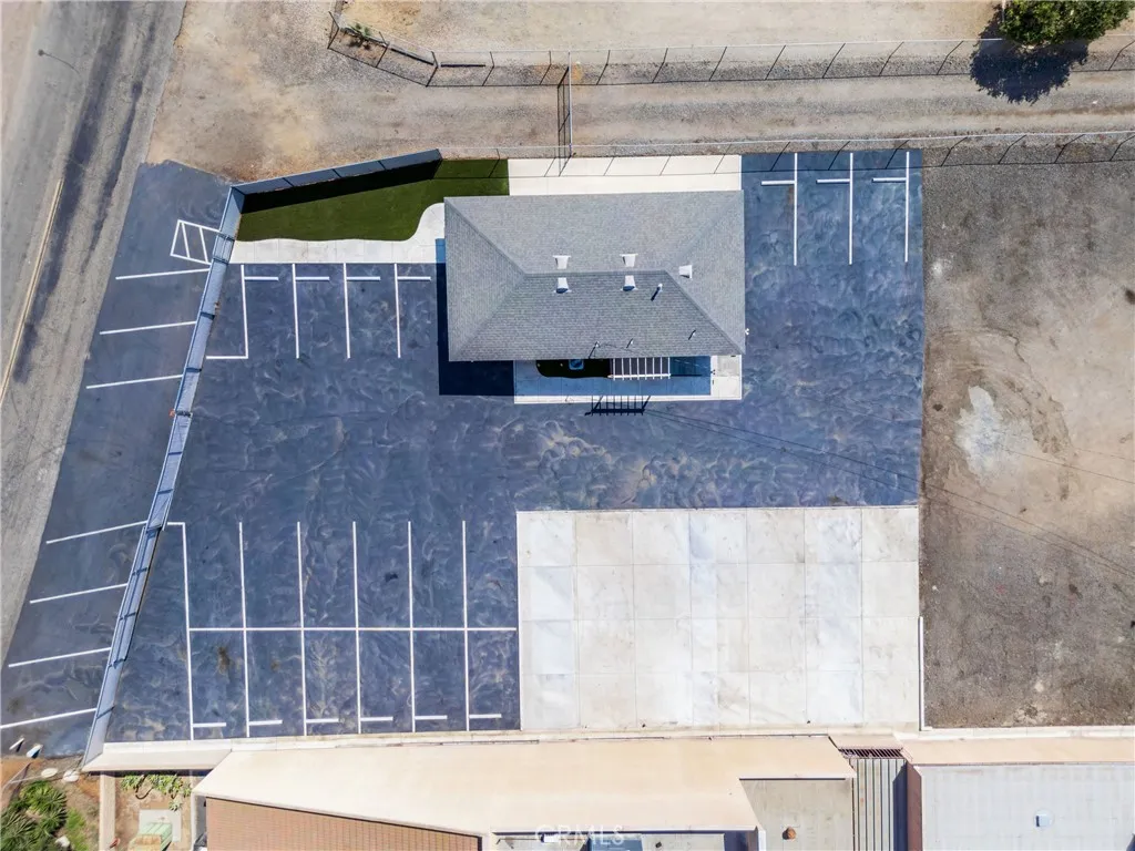 Asphalt paved parking lot, concrete and artificial turf  
Well maintained-Low maintenance