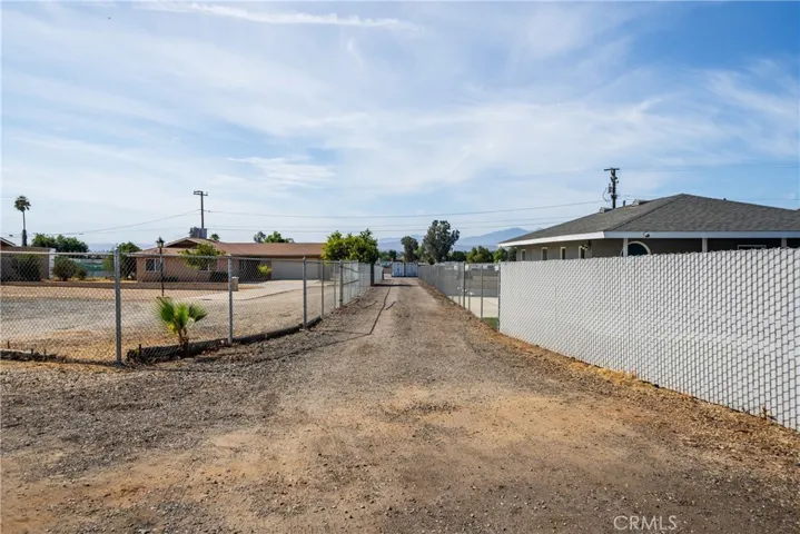 fenced driveway to property