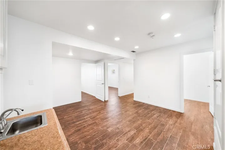 from kitchenette showing 3 office door office spaces/ side hall area for files, office equipment, etc.