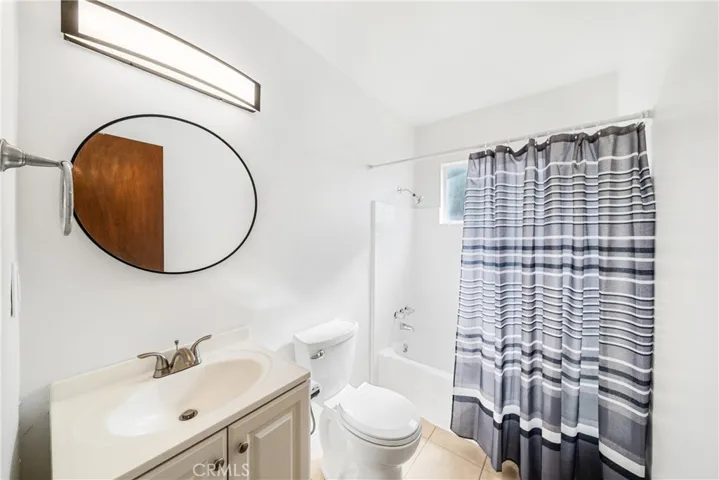bathroom 1 tile and newer sink vanity