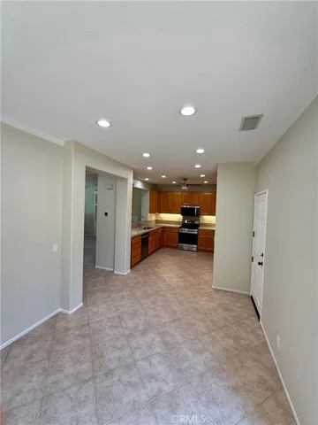 Open dining room leads out to the patio and gated back yard.