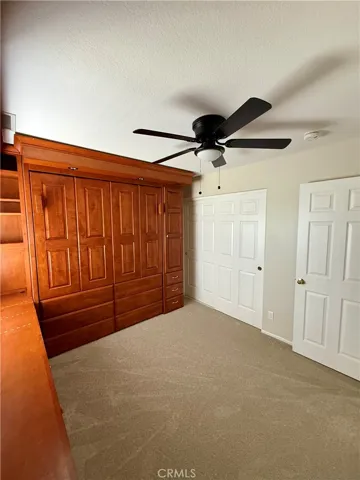 Secondary bedroom with Murphy bed and built in office.