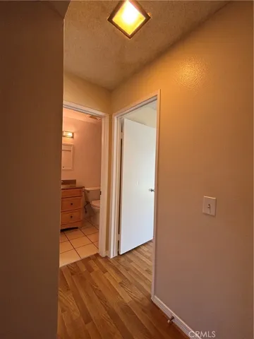 hallway to bedroom and bathroom
