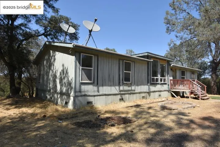 View of home's exterior featuring crawl space