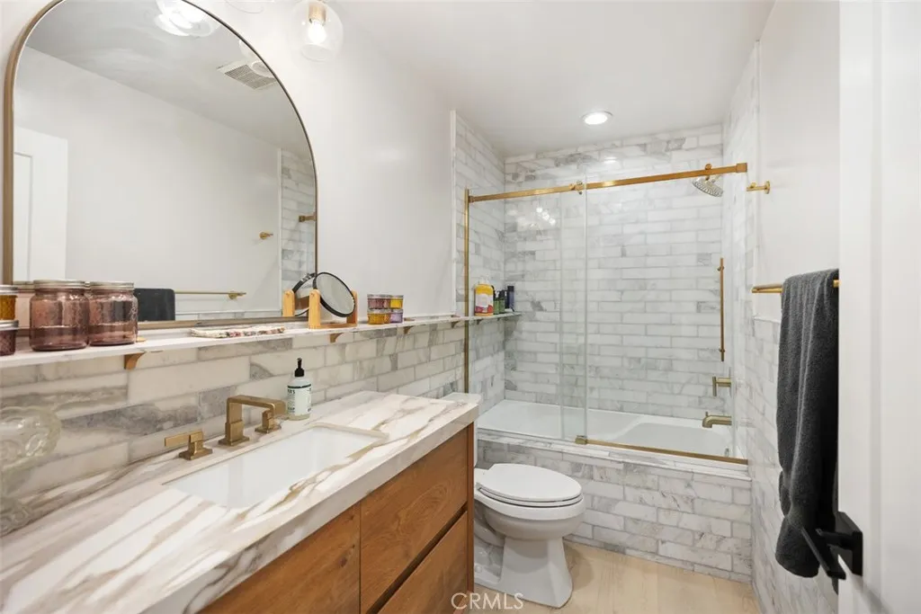 Guest bathroom with Jacuzzi tub and new vanity with new countertop