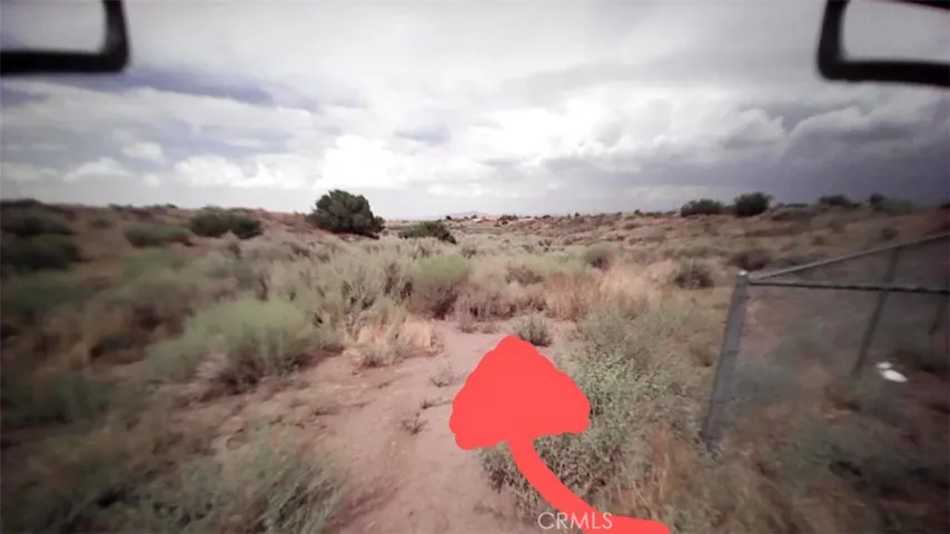 Entrance to property. Property extends approximately from the fence line towards the railroad.