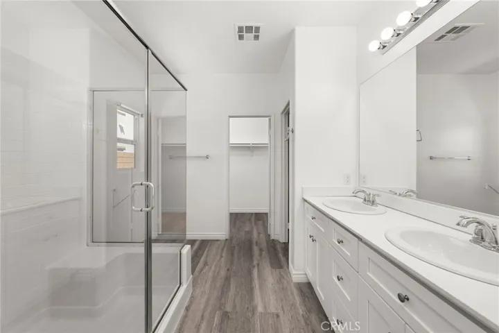 Primary Bathroom- Stand Up shower, Dual Sinks, Toilet, large walk in closet