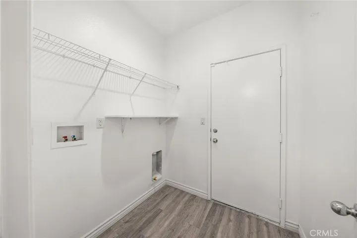 Indoor Laundry room. washer and gas dryer hook ups. Leads to garage.