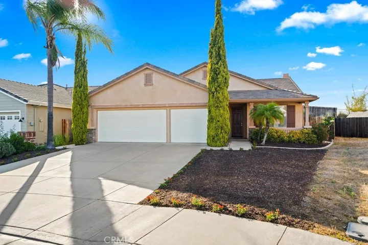 Front of Home with 3 car garage and low maintenance landscaping