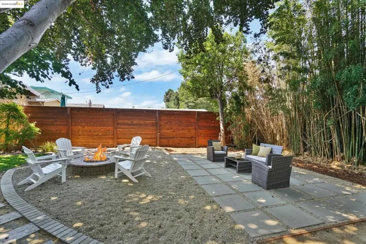 View of patio featuring an outdoor living space with a fire pit