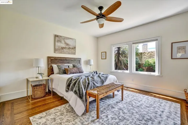 Bedroom with wood finished floors and ceiling fan
