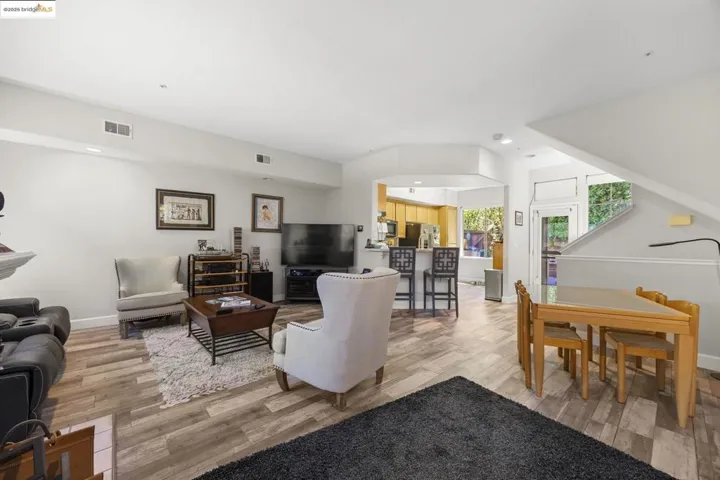 Living room with recessed lighting and light wood-style floors