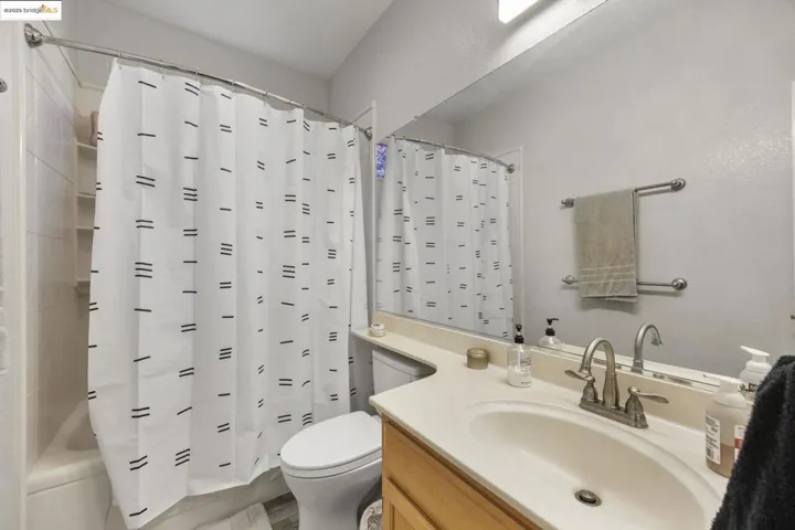 Full bathroom featuring vanity and shower / bath combo