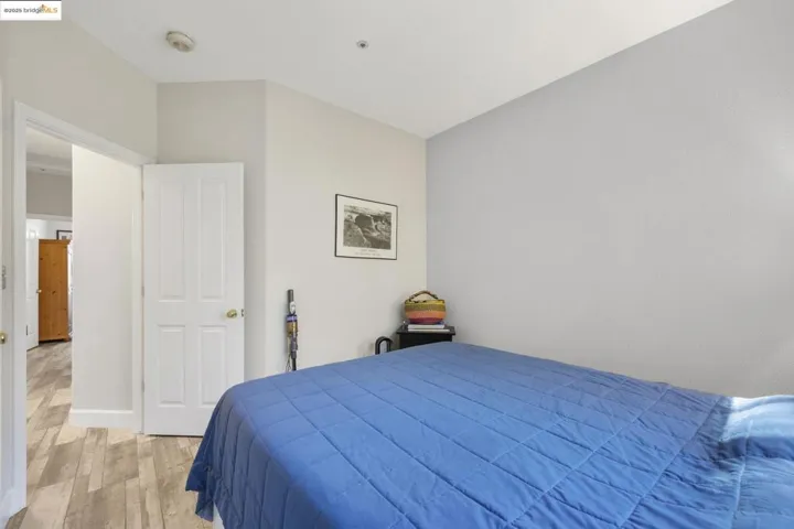 Bedroom featuring light wood-style flooring and baseboards