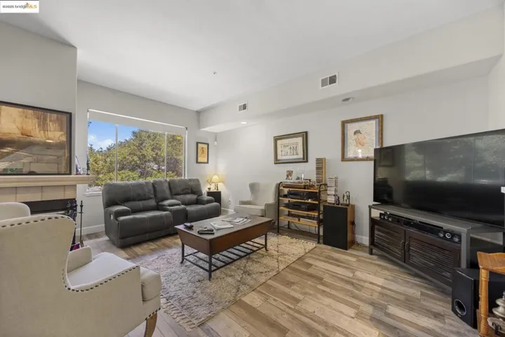 Living room with light wood finished floors and baseboards