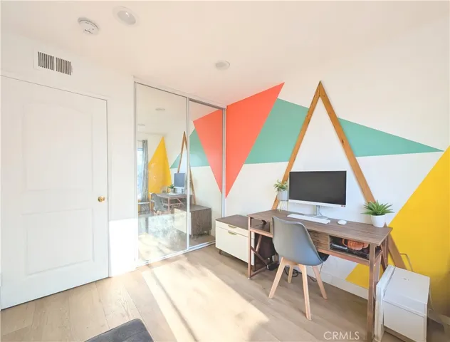 bedroom with mirror closet