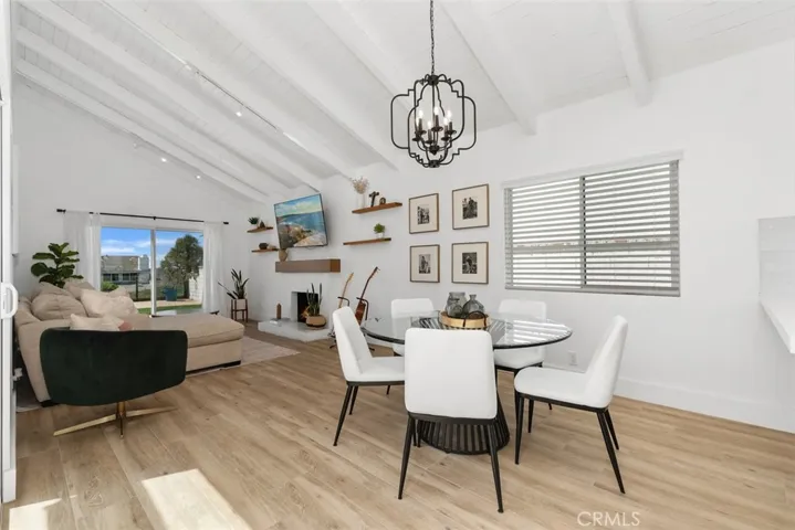 Dining area open to living room, with ocean views.
