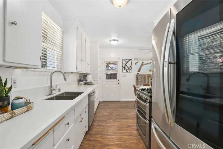 This fresh kitchen has all you need for family meals and a charming eat in kitchen nook as well!