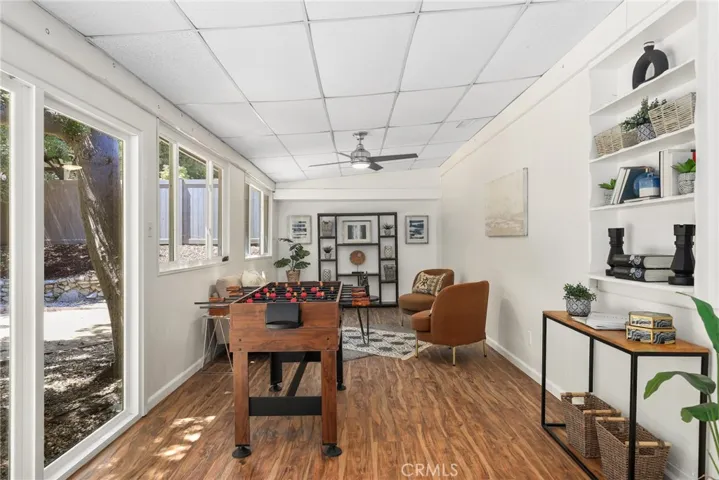 Love this extra long family room that leads out to your grassy yard....so much space to work with!