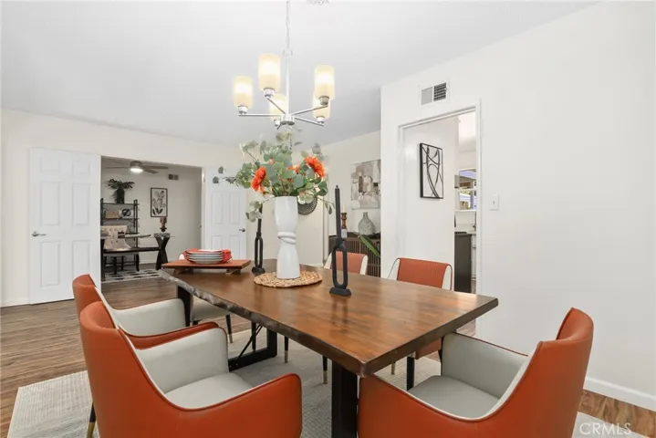 Formal dining area in the foreground with the 4th bedroom and its double doors in the back ground as an office for now.