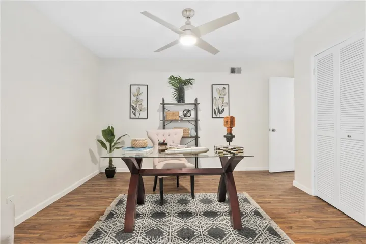 This is the 4th bedroom space currently being used as an open office with double doors to the living space.