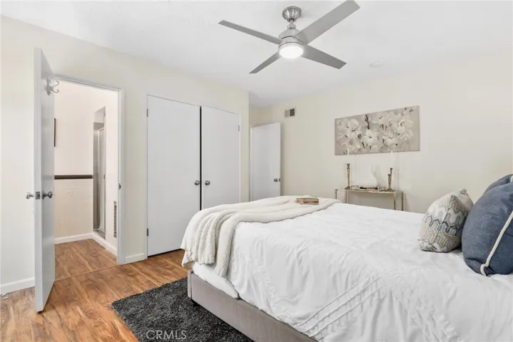 Primary Suite showcasing attached bathroom and double door closet.