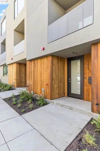 Property entrance featuring stucco siding