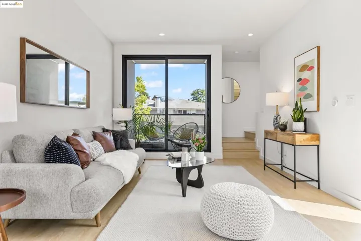 Living area featuring light wood finished floors and recessed lighting