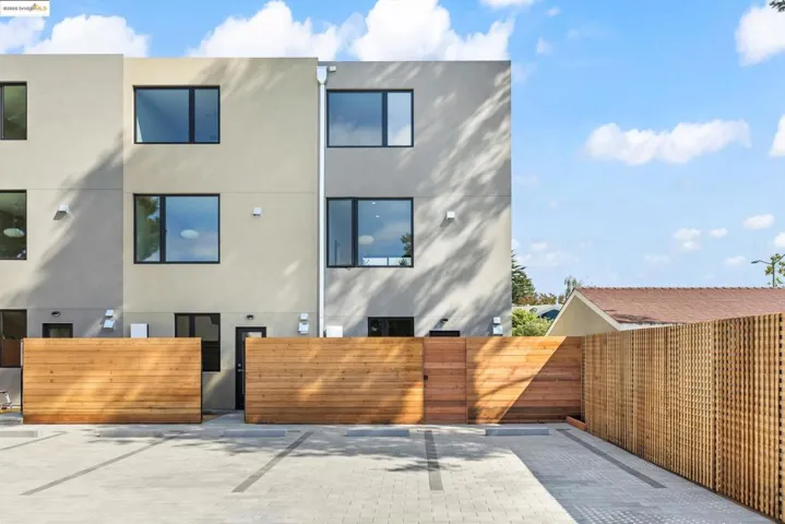 Back of house featuring stucco siding