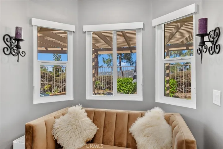 Primary Suite Sitting area with overhead reading light and view