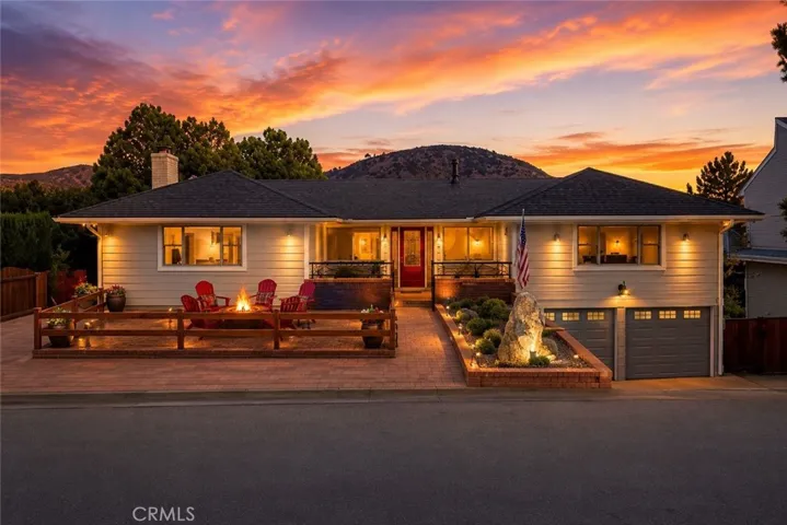 Front yard with fire pit and private courtyard. RV area and parking option in front.