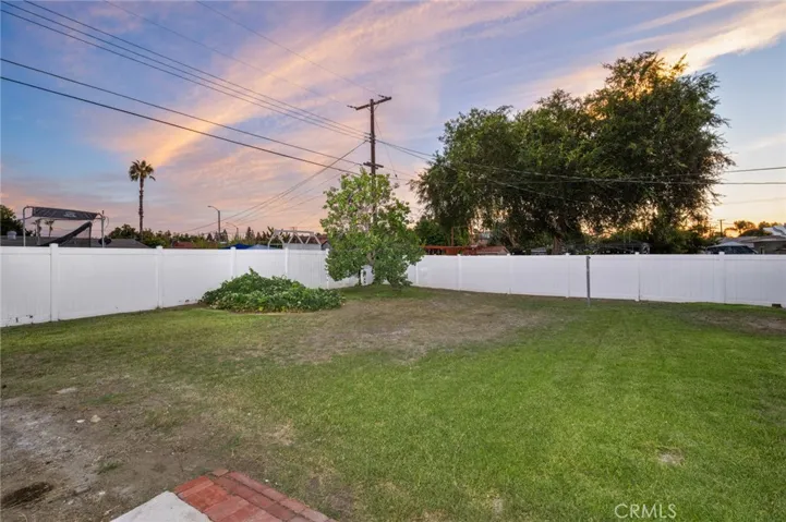 Outside, the private & lush backyard serves as your personal oasis