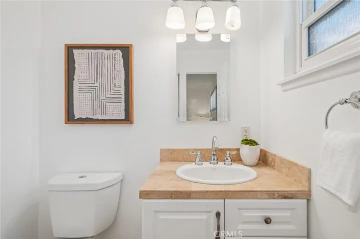 Tasteful powder room w/ window for refreshing breezes & sunlight