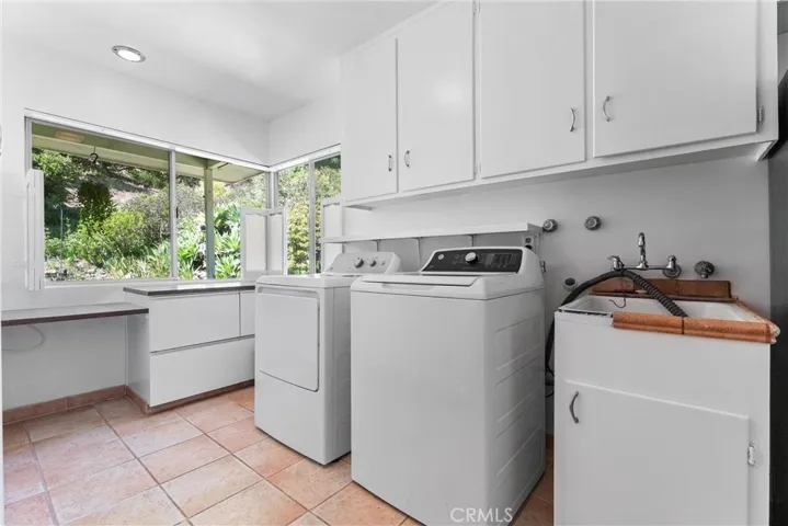 Large indoor laundry room with tons of storage