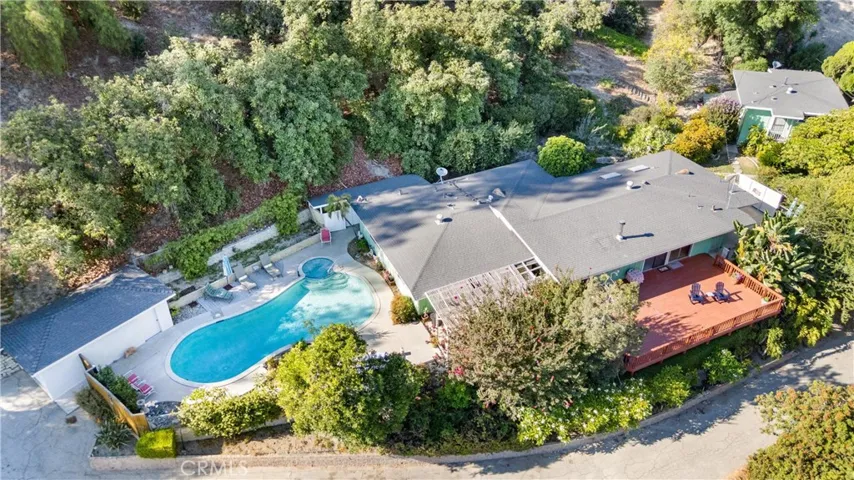 Privacy, two homes on a lot, two garages, two driveways, an abundance of producing Avocados trees, Citrus, Pomegranate and more.  Gardner paradise.