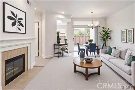 Open floor plan with fireplace.  Virtual staging.