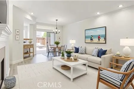 Light and airy living space that opens out to a oversized patio.  Virtual staging.