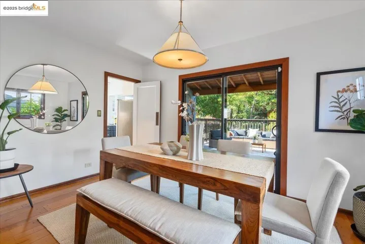 Dining area with hardwood / wood-style floors