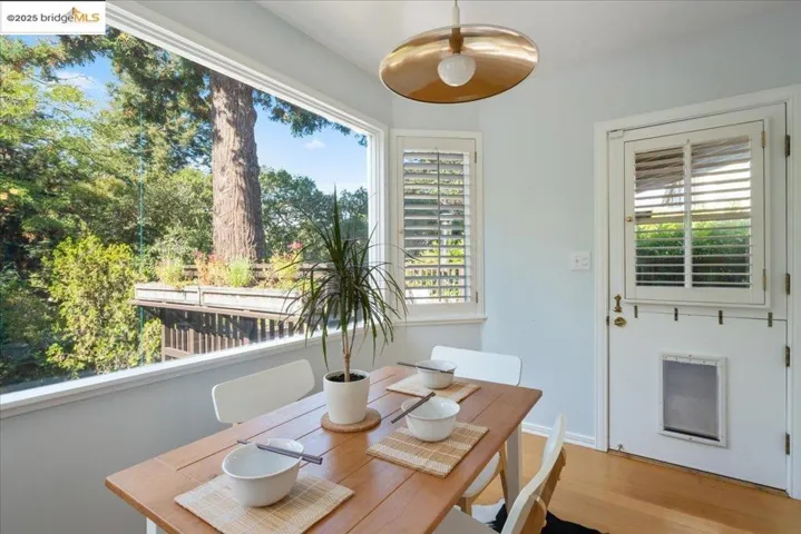 Dining room featuring wood finished floors and baseboards