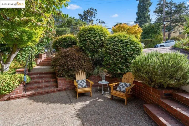 View of patio with stairway and grilling area
