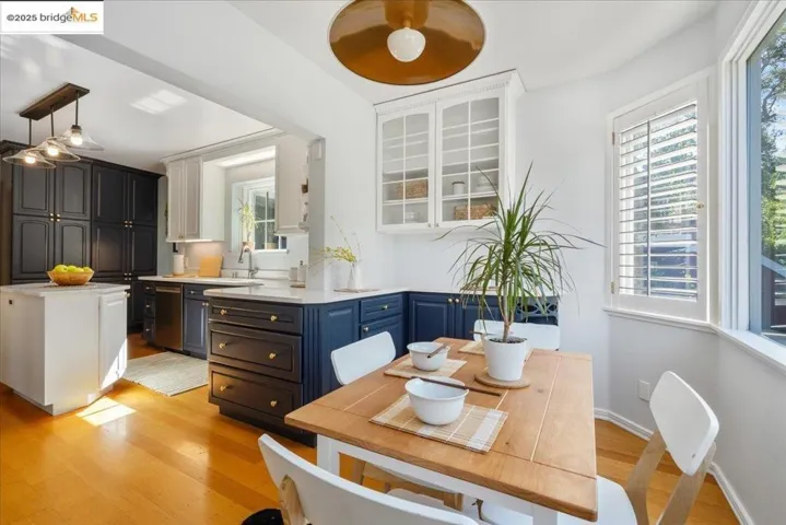 Dining space with light wood-style floors and plenty of natural light