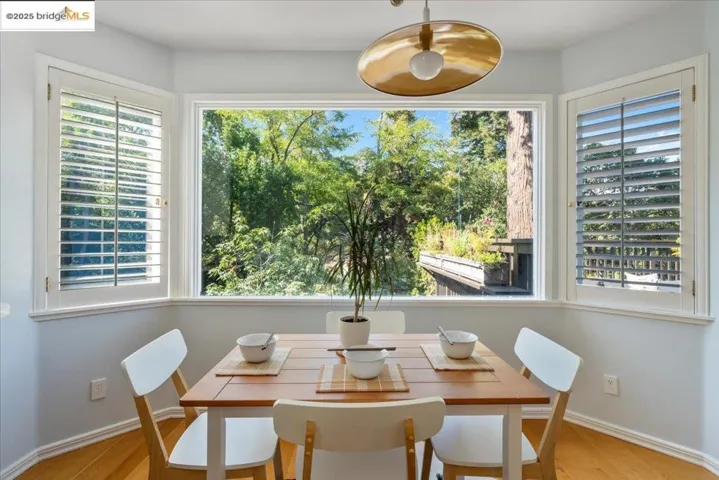 Dining room with baseboards and wood finished floors
