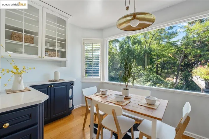 Dining area featuring light wood-type flooring and baseboards