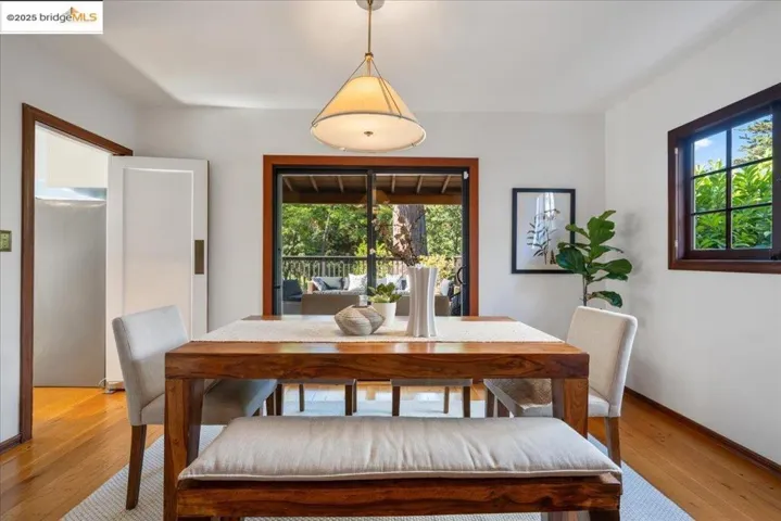 Dining area with light wood-style floors and baseboards