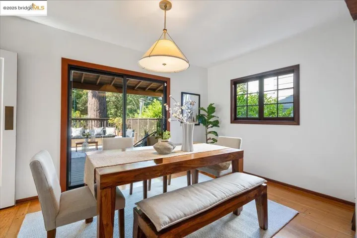 Dining area with light wood finished floors and baseboards