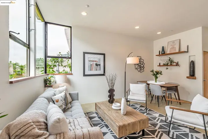 Carpeted living area featuring recessed lighting