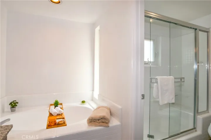 primary suite has soaking tub and shower