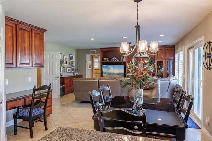 Looking across the kitchen and breakfast nook into the family room. Note the work station on the left