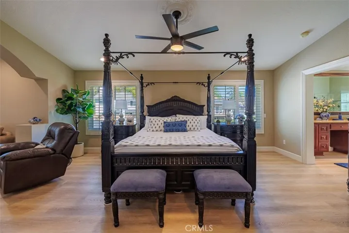 Stepping through the double-doors into the primary bedroom